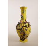 A Chinese yellow ground porcelain vase with applied and enamelled peach tree decoration, seal mark