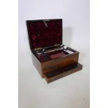 A Victorian rosewood vanity case, with fitted interior and cut glass fittings, with silver plated