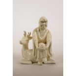 A Chinese blanc de chine figure of a lohan seated on a deer, impressed marks verso, 5½" high