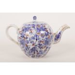 A late C18th/early C19th blue and white porcelain teapot of bulbous ribbed design, decorated with