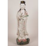 A late C19th Chinese polychrome porcelain figurine of Quan Yin, 13" high