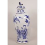 A C19th Chinese blue and white porcelain baluster vase and cover decorated with female figures in