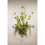 An art glass vase of faux flowers with glass leaves and bell flowers, 27" high