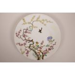 A Chinese polychrome porcelain cabinet plate with enamel decoration of birds amongst trees in