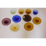 A collection of Egyptian coloured glass, including six small dishes, 7" diameter, and four bowls