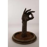 A cast iron sculpture of a hand, 15"