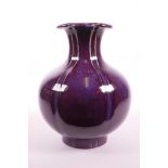 A Chinese mauve flambé glazed pottery vase of lobed form, 6 character mark to base, 10" high