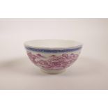 A Chinese blue and white porcelain rice bowl decorated with a puce enamel landscape scene, seal mark