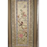 A framed Chinese embroidered silk panel depicting birds, insects and flowers, 9½" x 22½"