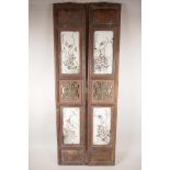 A pair of Chinese polychrome porcelain panels set with four plaques depicting insects amongst