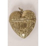 A heart shaped brass vesta case with embossed foliate decoration