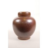 A Chinese rust glazed porcelain ginger jar and cover, 6 character mark to base, 7" high