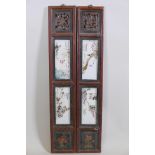 A pair of Chinese polychrome porcelain panels set with four plaques depicting birds amongst