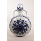 A Chinese blue and white porcelain two handled flask with Yin Yang decoration, 6 character mark to