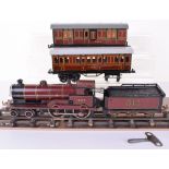 Bing 0 gauge c/w 4-4-0 LMS locomotive 1924 and two coaches,