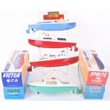 A Sutcliffe Boats Shop Retailers Wire Display Stand complete with four boxed Sutcliffe boats