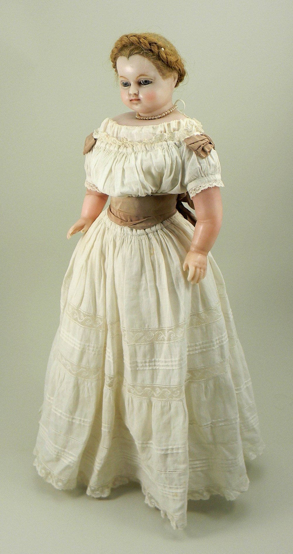 ‘Charlotte’ a poured wax shoulder head doll, probably by H.J Meech, English circa 1870,