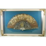 A beautiful mother of pearl and painted card fan,