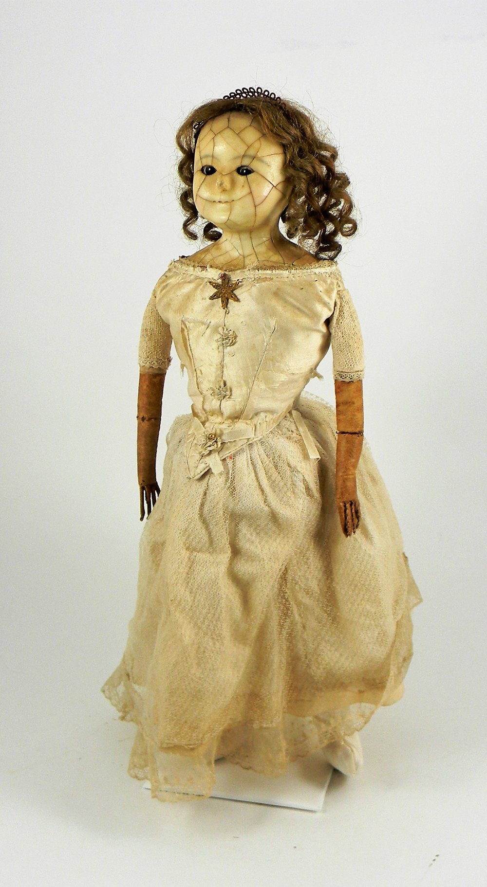 A wax over composition wire-eyed shoulder head doll, English circa 1860,