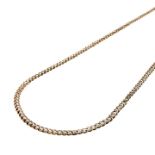 Long necklace in gold with a low title