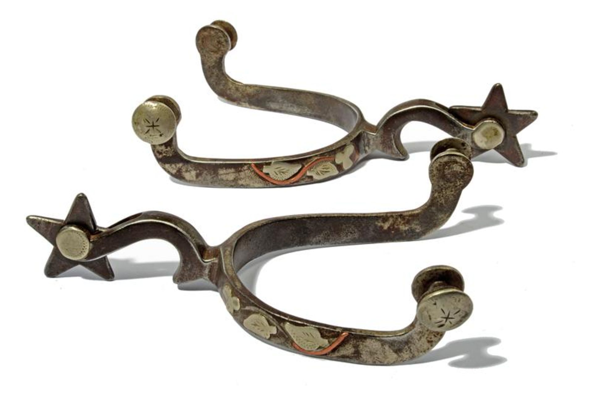 A pair of silver decorated McChesney spurs