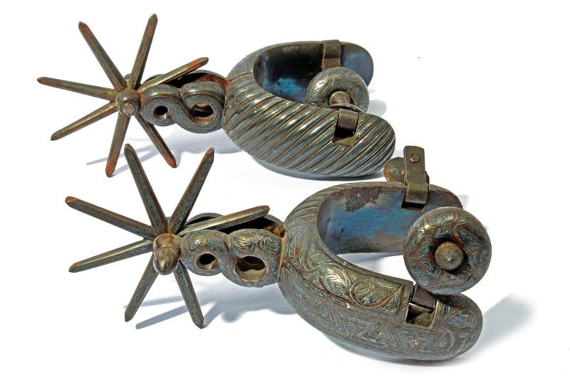 A silver decorated pair of Chihuahua type spurs