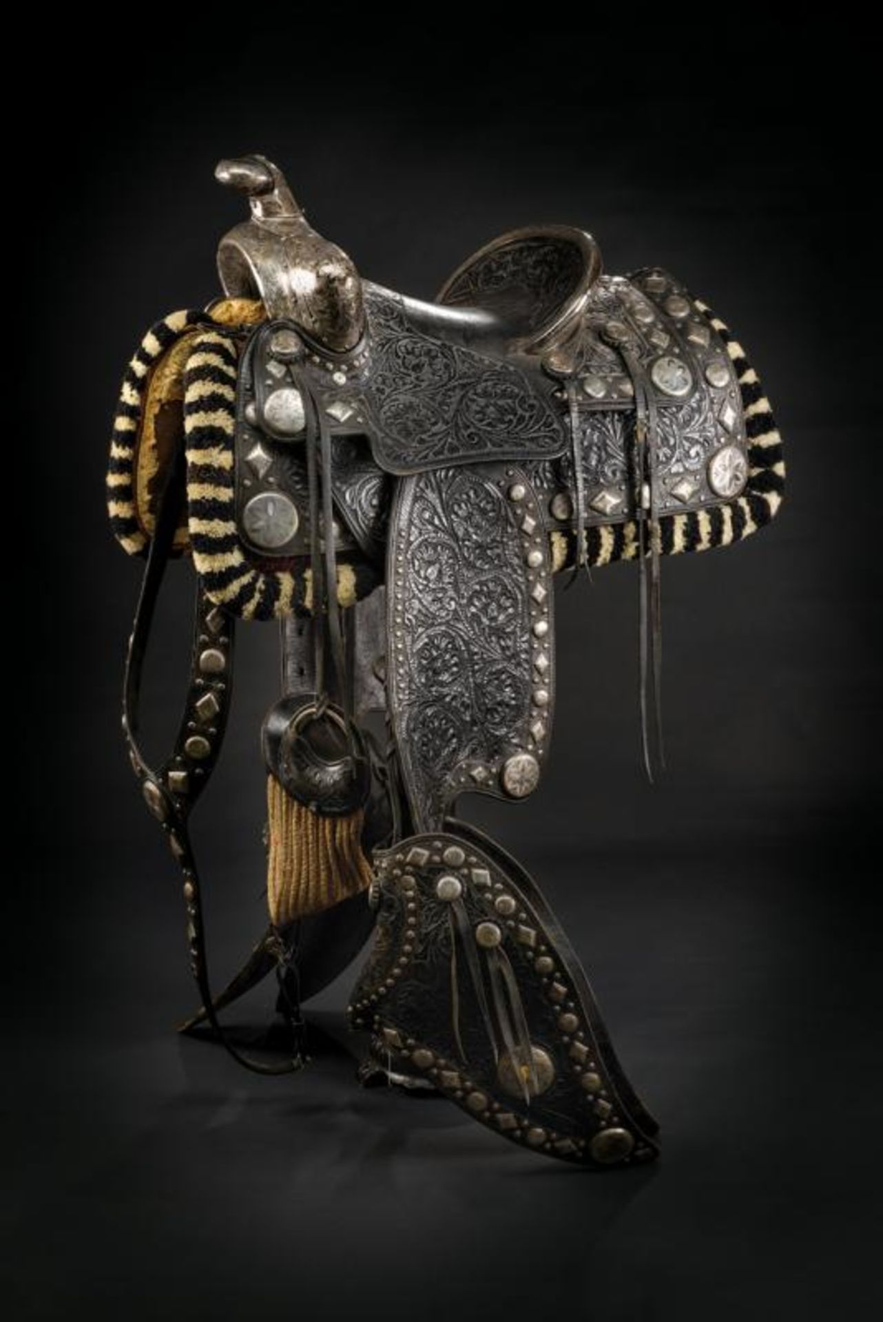 A highly important and beautiful silver mounted San Fernando Parade saddle with stirrups, spurs and