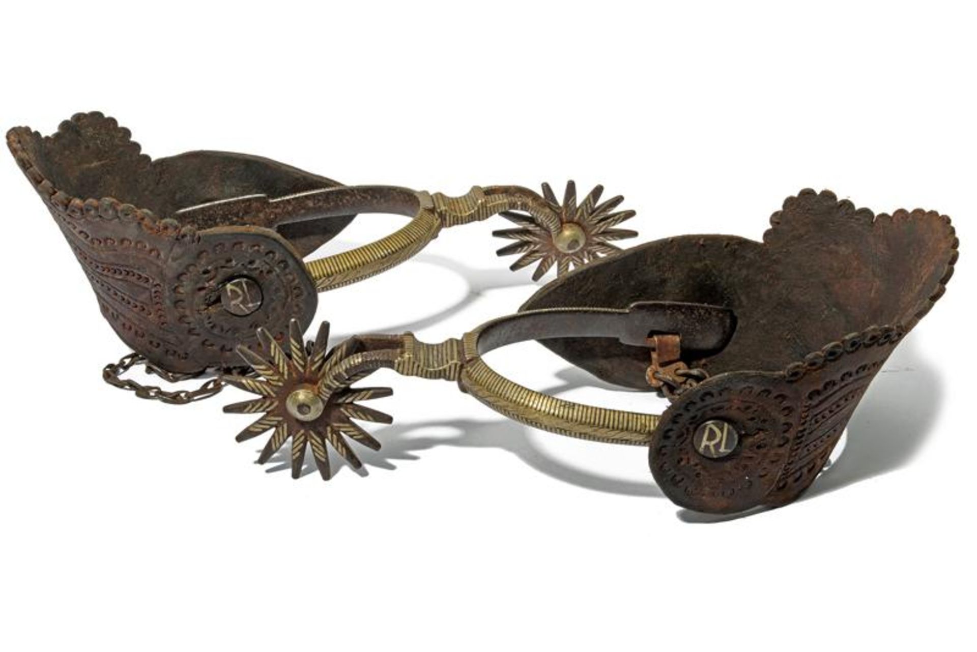 A pair of silver decorated spurs