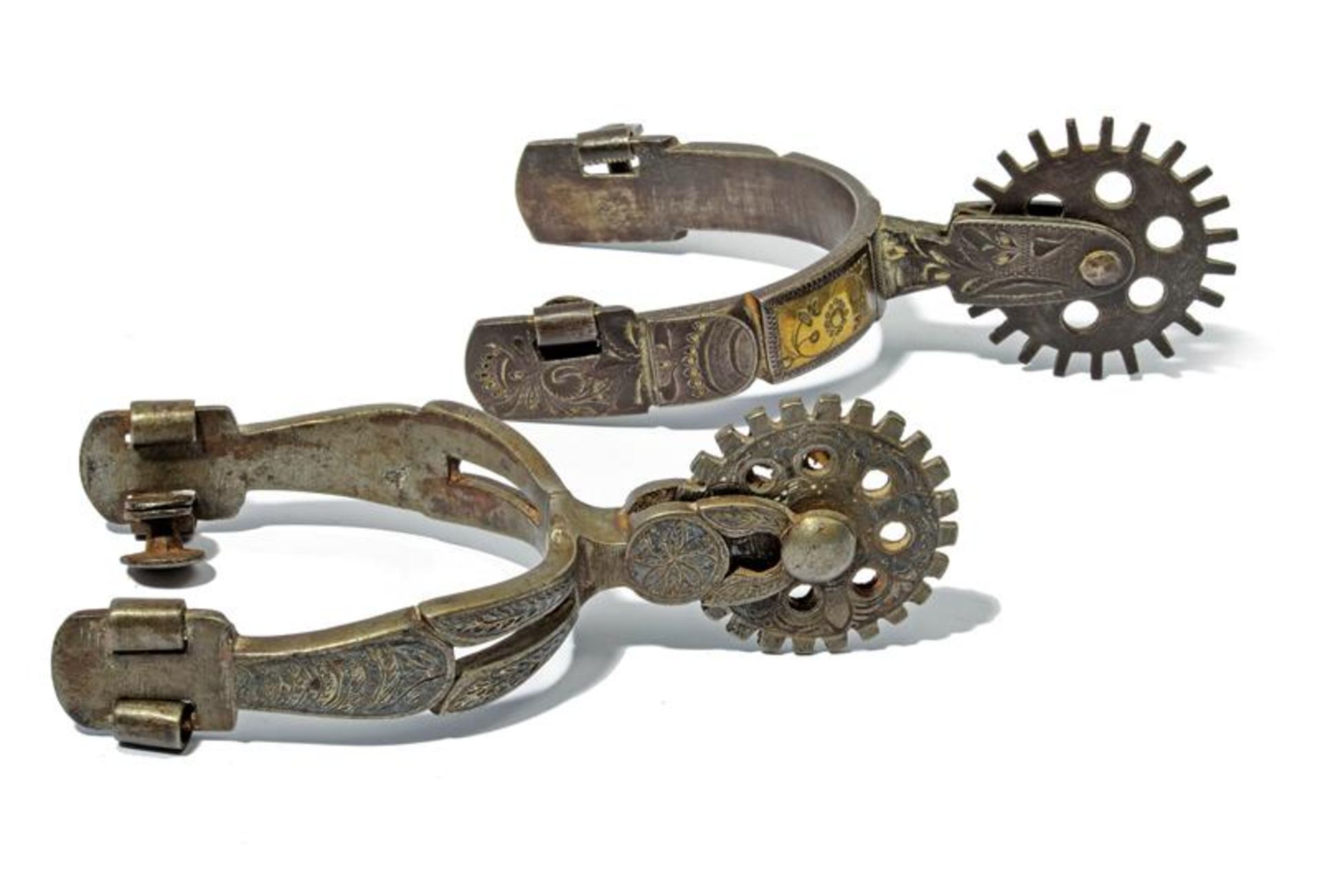 A lot of two silver decorated spurs