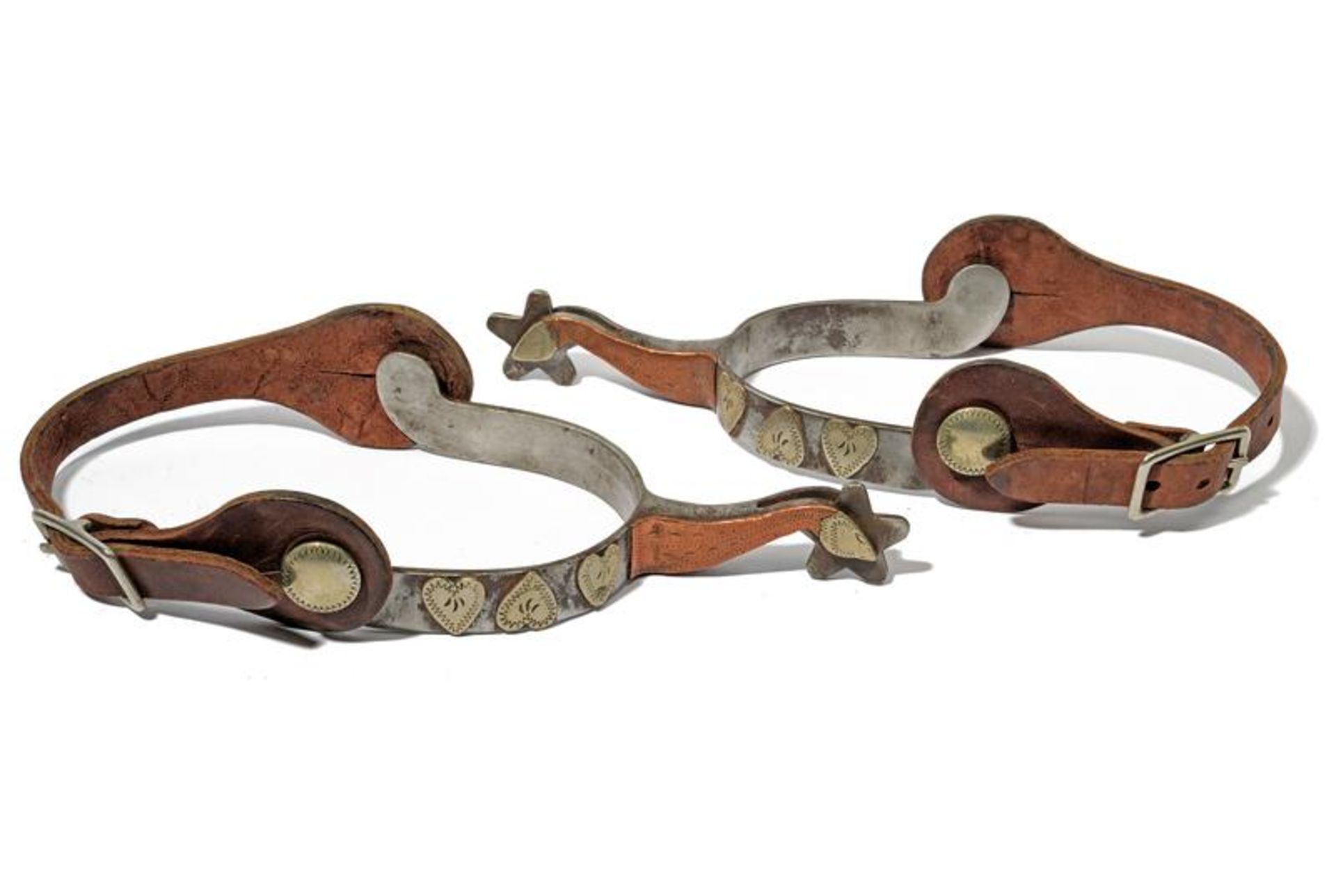 A pair of silver decorated spurs