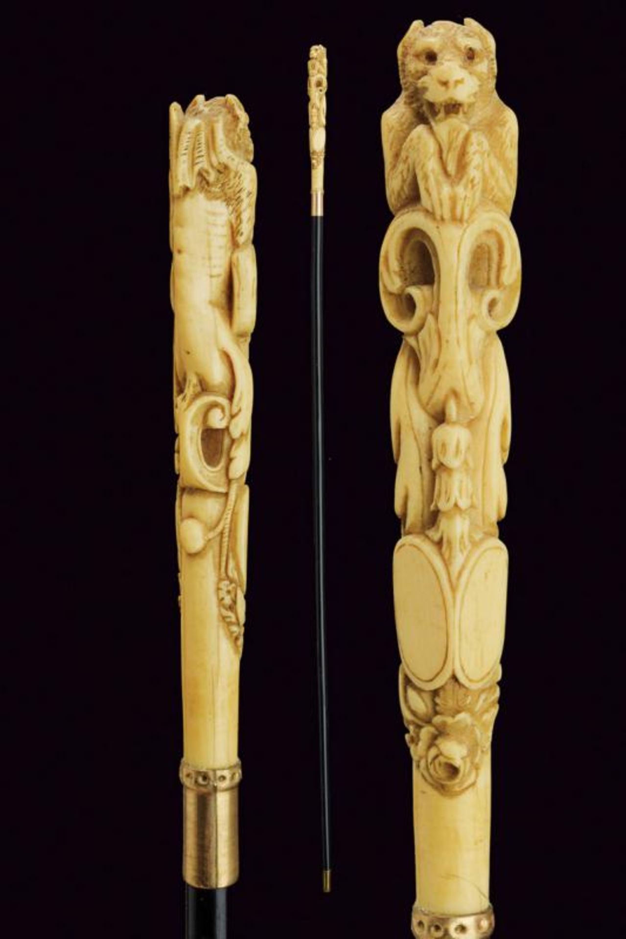 A walking stick with carved ivory grip