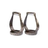 A pair of silver and niello decorated stirrups