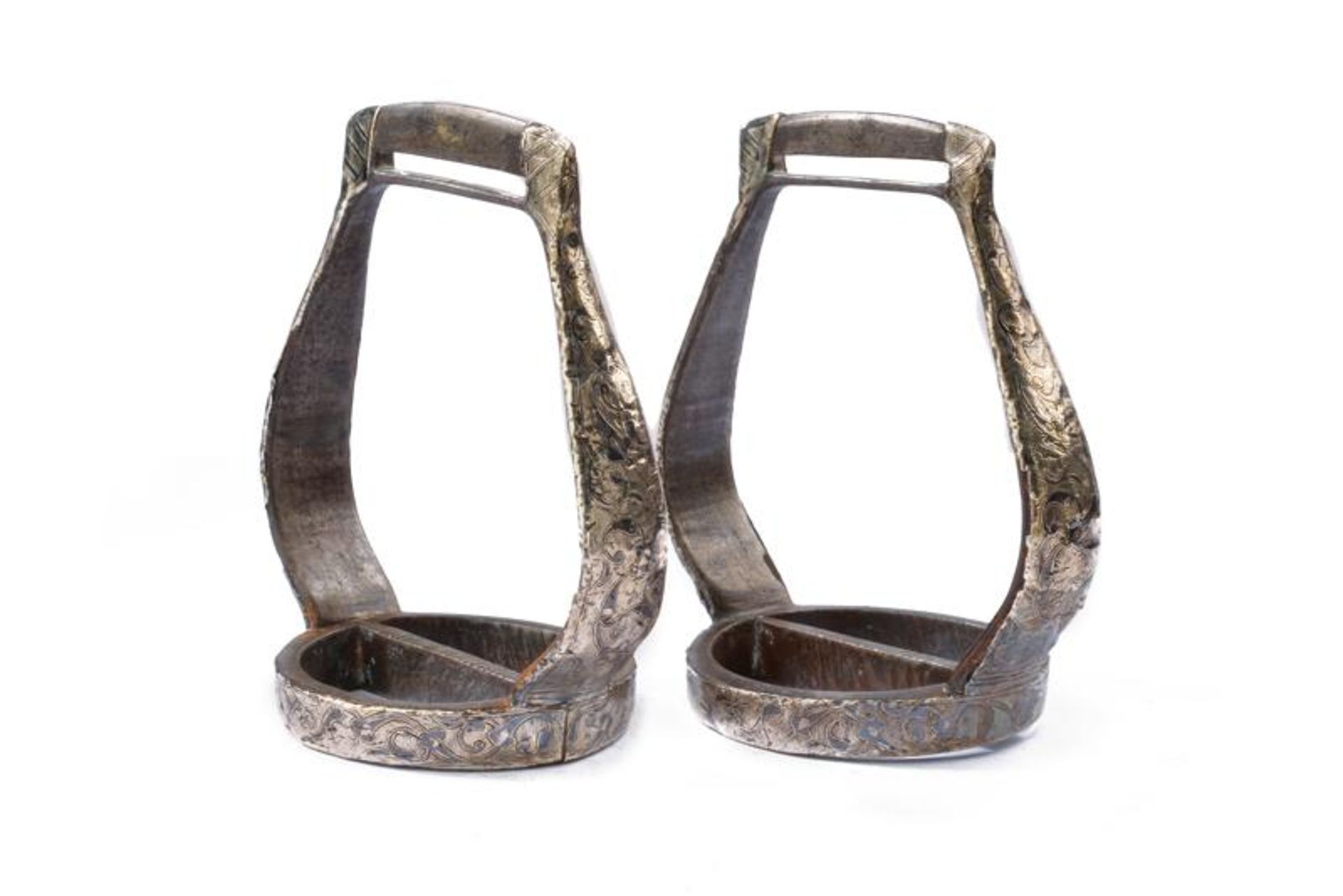 A pair of silver and niello decorated stirrups