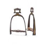 A rare pair of gold decorated stirrups