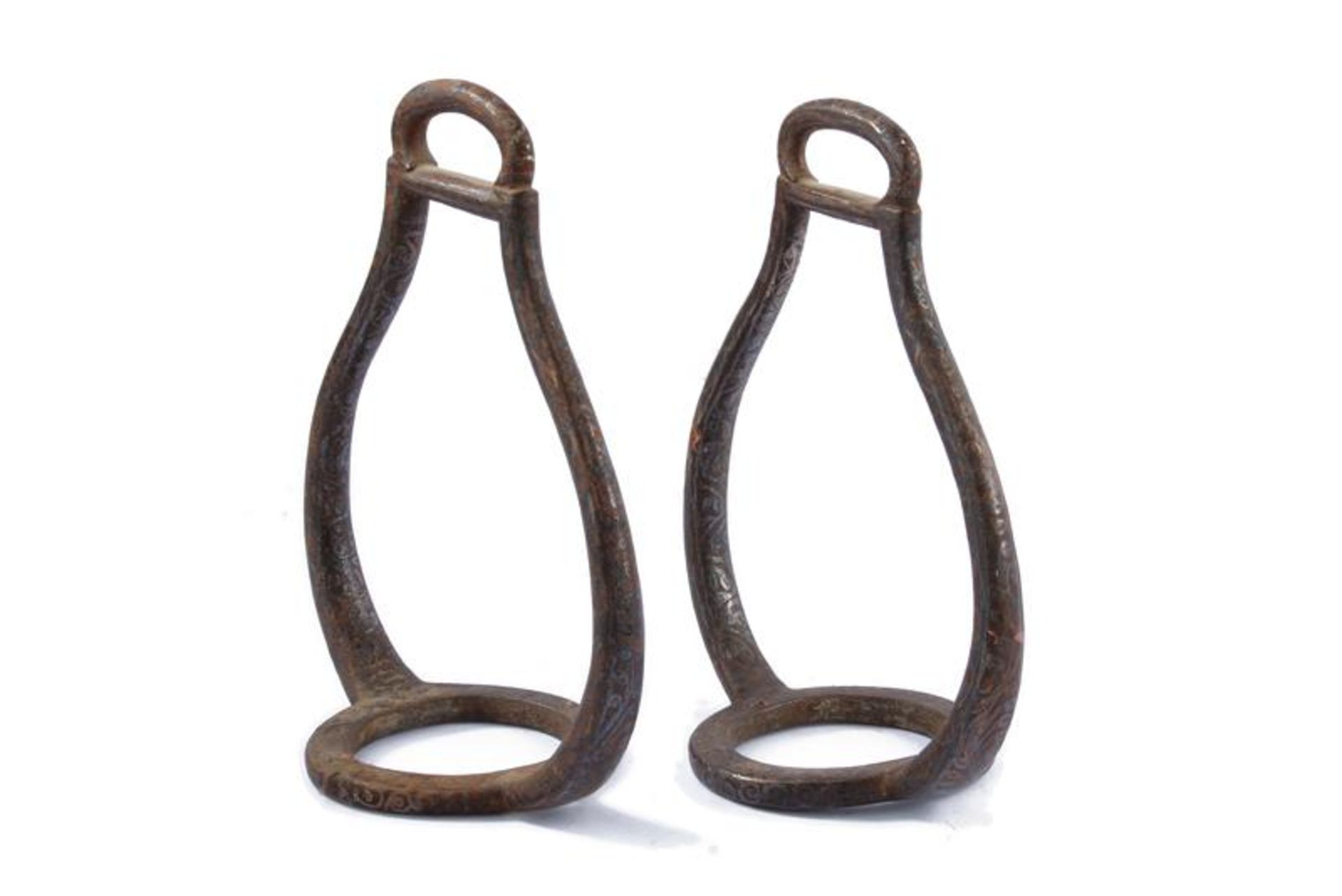 A pair of silver decorated stirrups