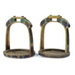 A fine pair of enameled stirrups