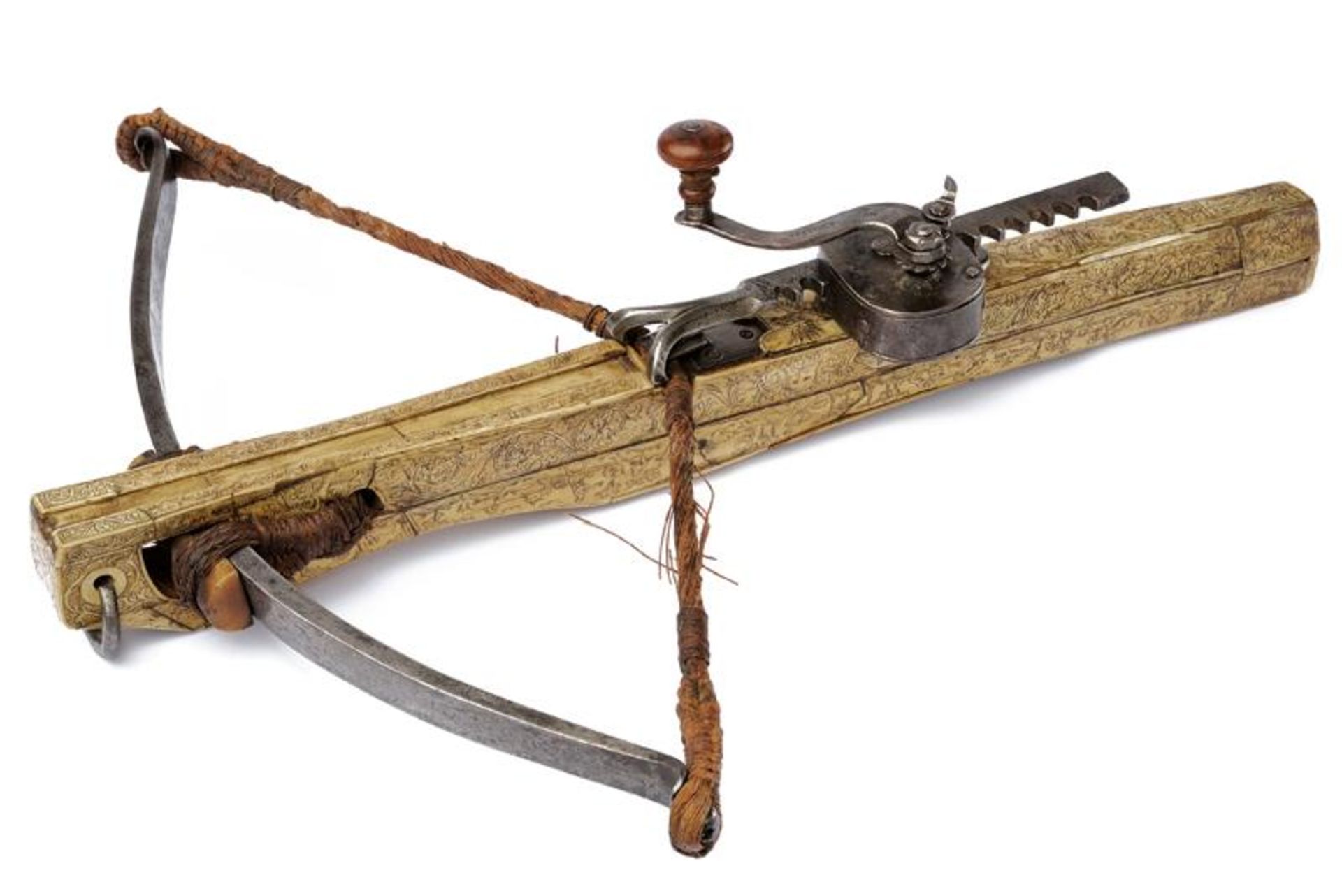 A beautiful engraved crossbow with its windlass