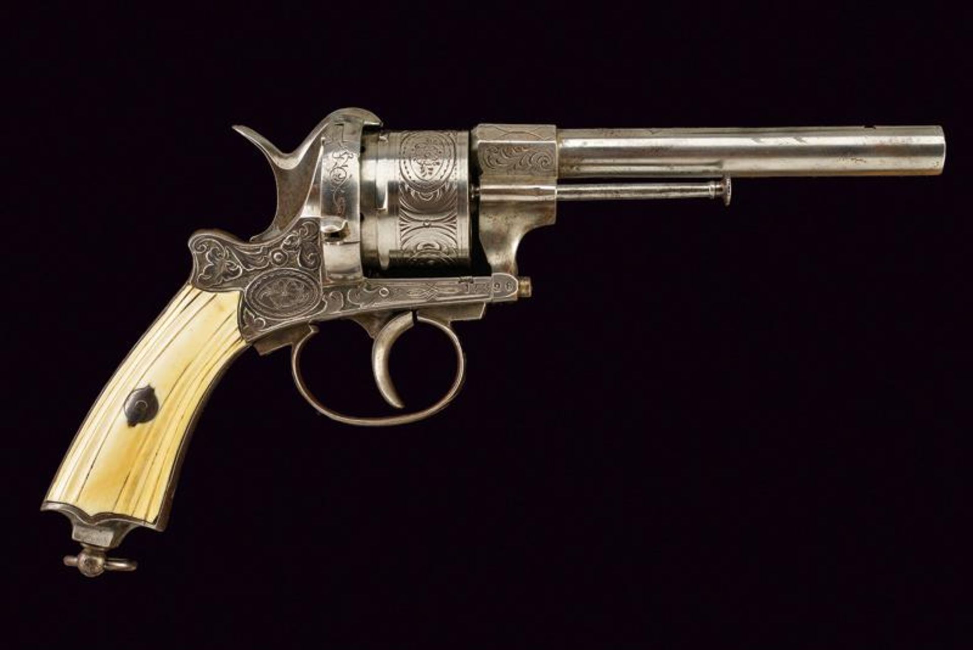 An engraved pinfire revolver