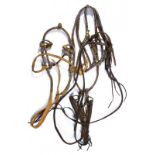 A lot of two bridles with snuffle bits