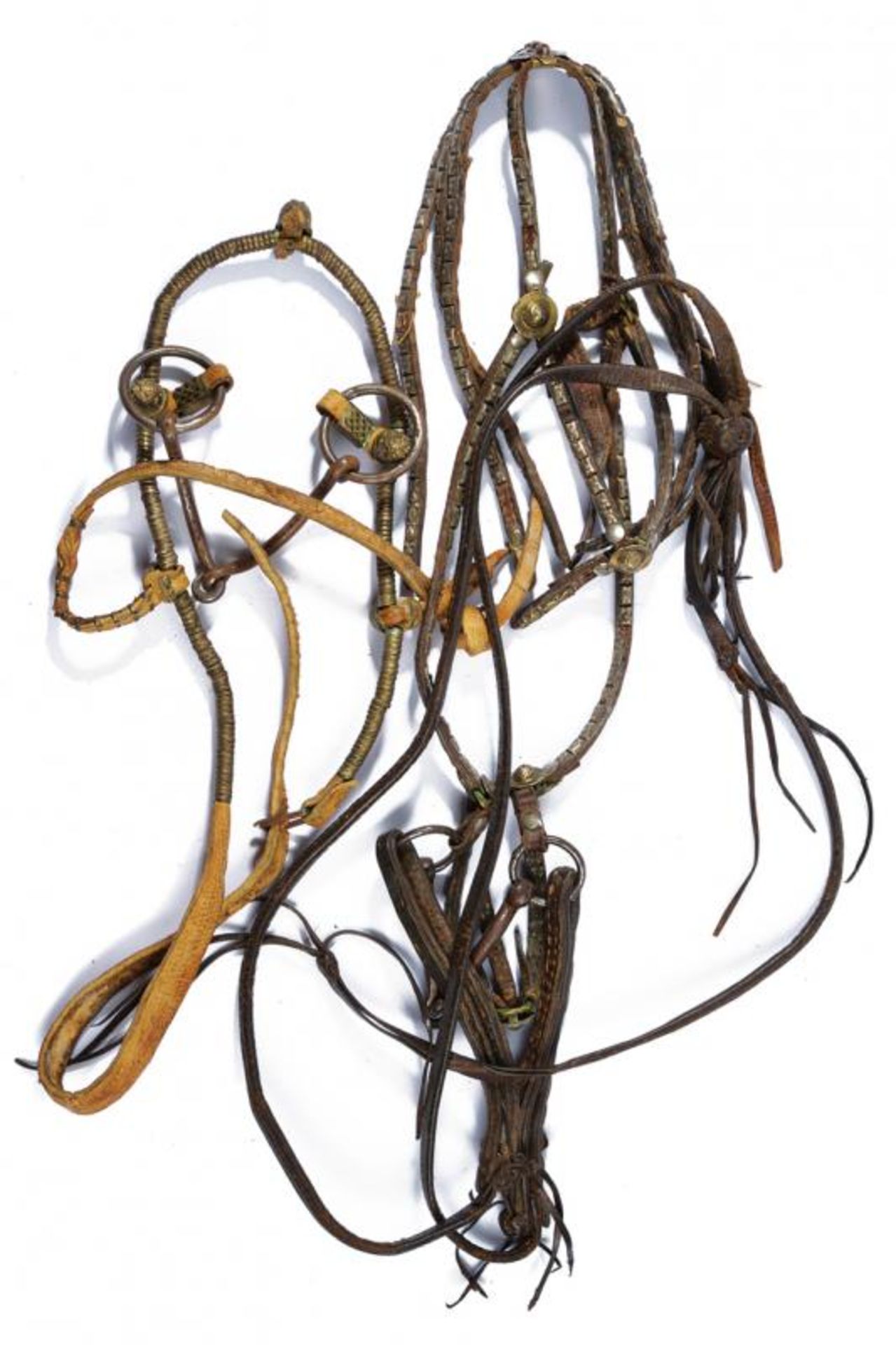 A lot of two bridles with snuffle bits