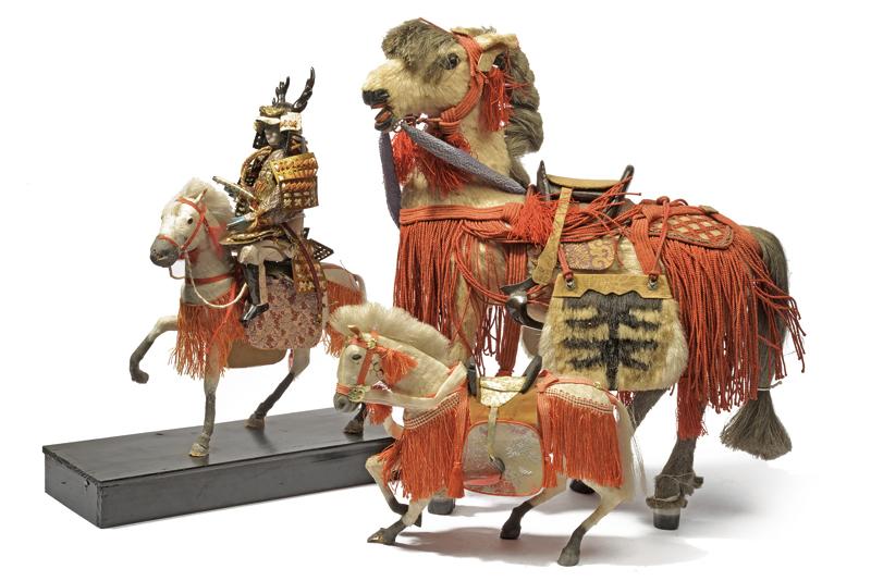 A group of three horse figures