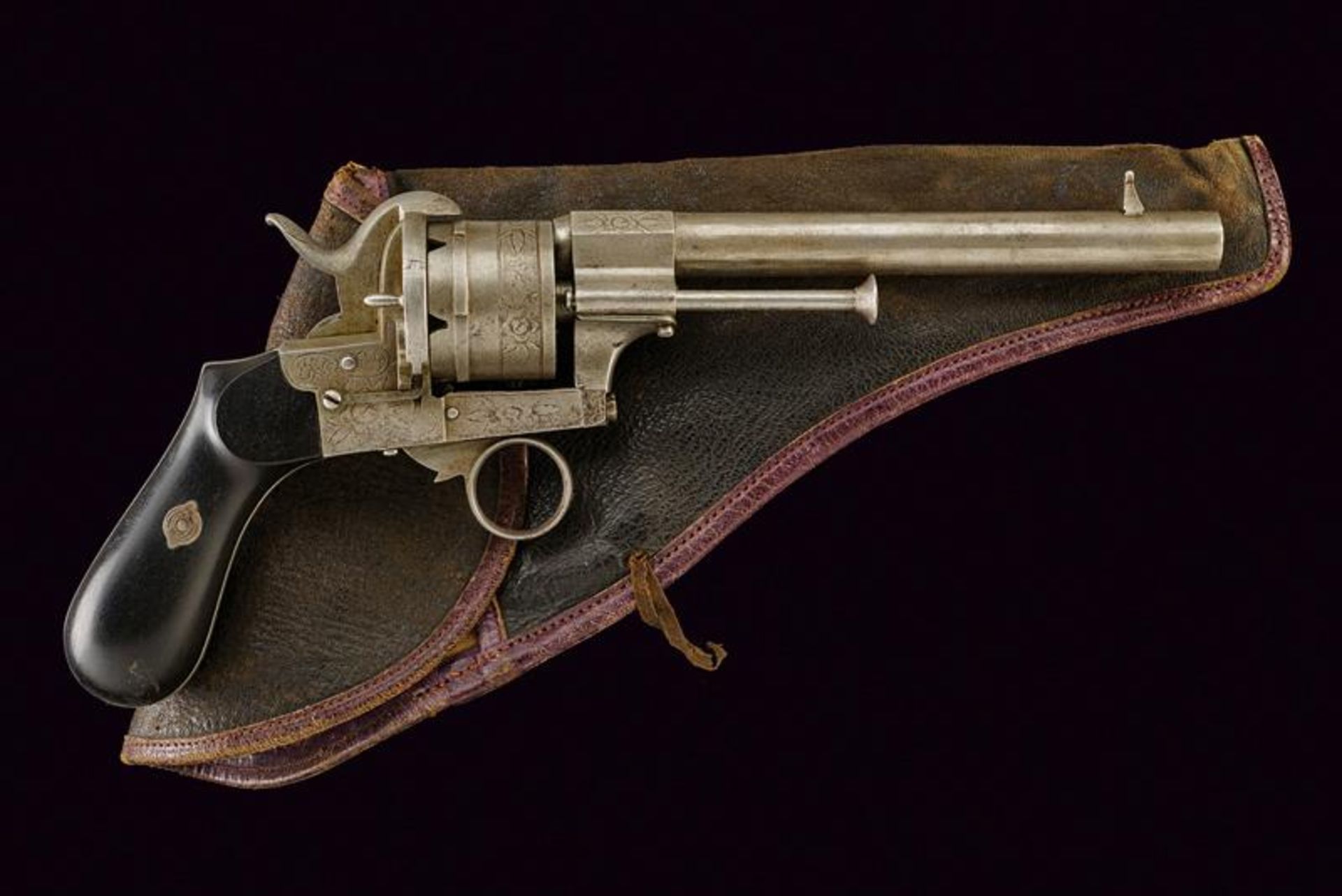A pin-fire revolver with holster