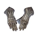 A pair of engraved gauntlets