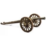 A big model of bronze cannon with gun carriage