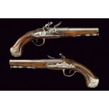 A pair of silver mounted flintlock pistols by Robert