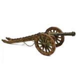 A model of bronze cannon with gun carriage