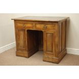 Late 19th century walnut desk, fielded panelled sides and cupboard doors, two drawers,