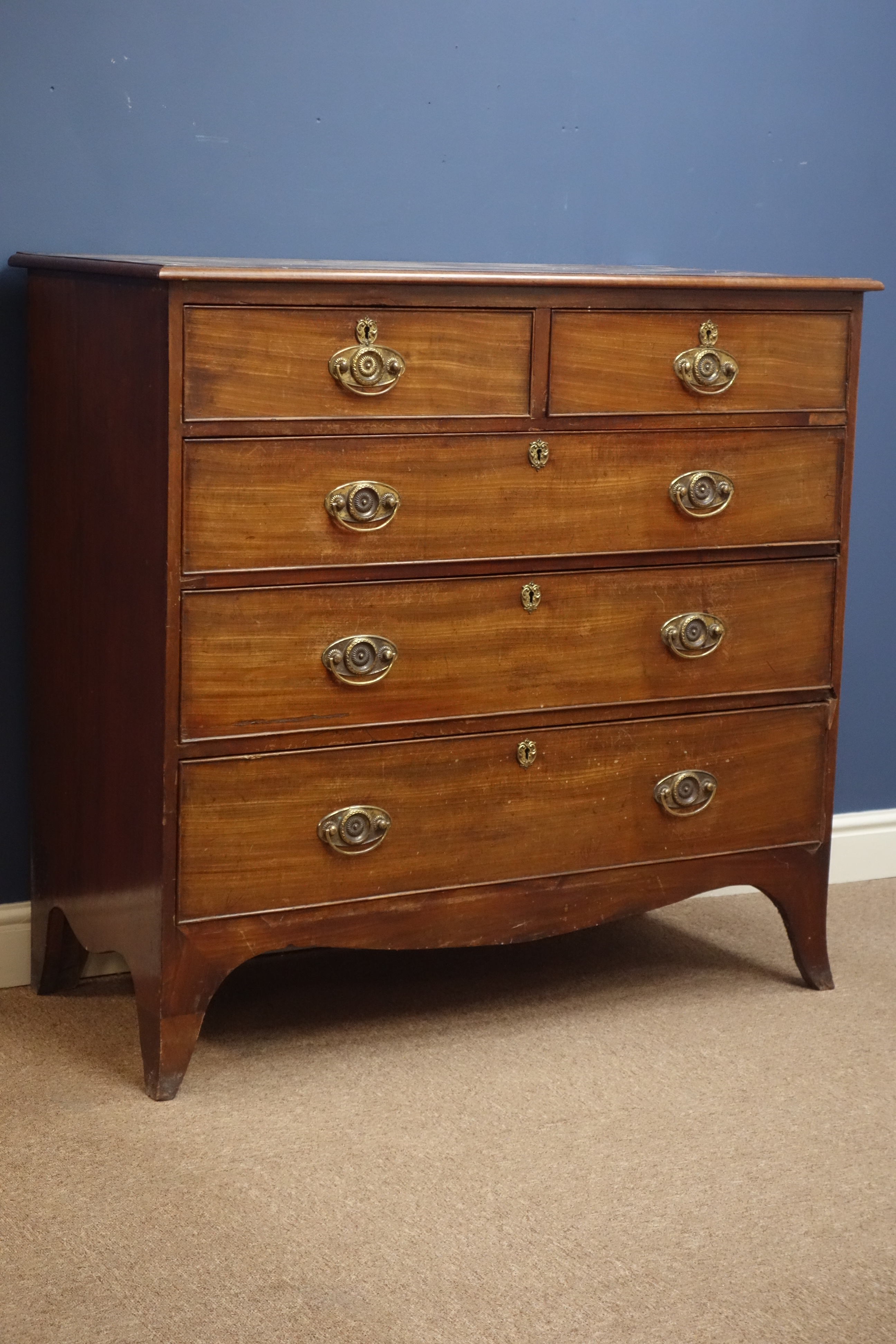 Early 19th century mahogany chest, two short and three long drawers, splayed bracket feet, W109cm,