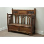 Early 20th century Arts & Crafts hall bench, carved fielded panels, hinged seat enclosing storage,