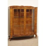 Early 20th century walnut display cabinet, enclosed by two astragal glazed doors, W104cm, H123cm,